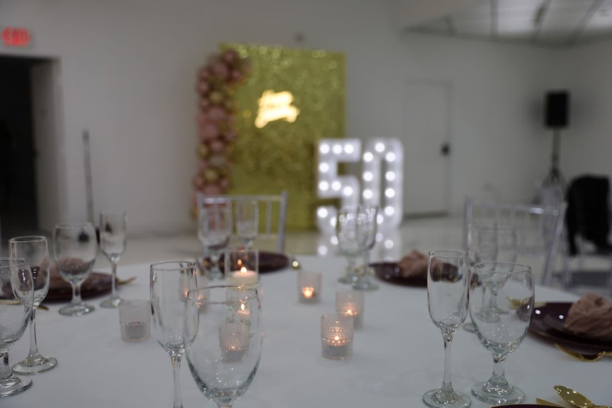 Table setting with 50th birthday backdrop