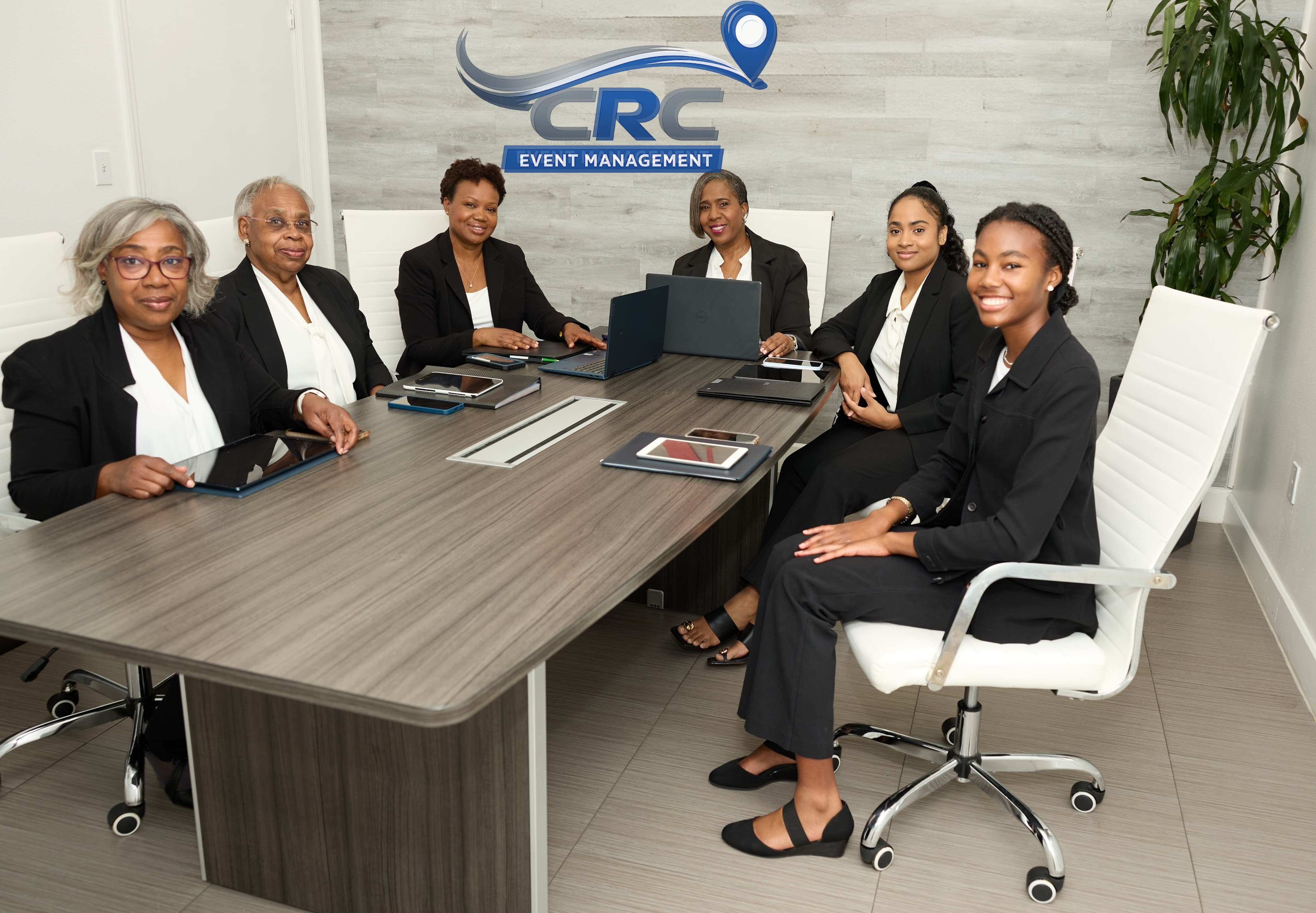 Team smiling in conference room